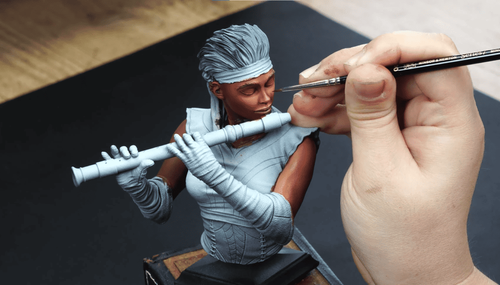 Miniature Natasha Blaine from Loot Studios' bundle Orconspiracy  being painted by Loot's artist