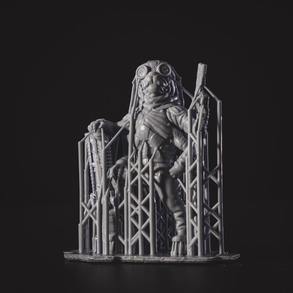 Cyberpug, free miniature from Loot Studios. It is 3D printed and ready for being cured and finished.