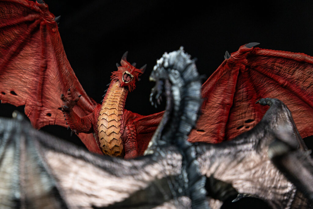 2 3d printed dragons facing each other. They are part of loot's collection